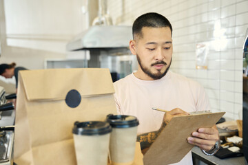 Responsible young man in charge of food delivery orders