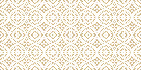 Vector ornamental seamless pattern in traditional arabian, moroccan, turkish style. Golden abstract mosaic background texture with stars, floral shapes. Gold and white ornament. Premium repeat design