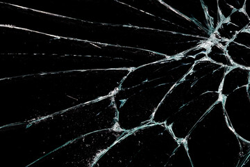 Cracks in the glass on black background.