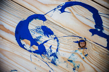 Blue paint on wooden background