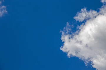Fototapeta na wymiar White clouds on blue background