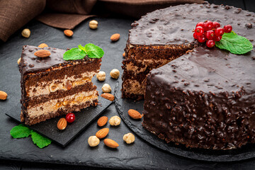 Delicious caramel chocolate tart, topped with nuts and hazelnuts, almonds
