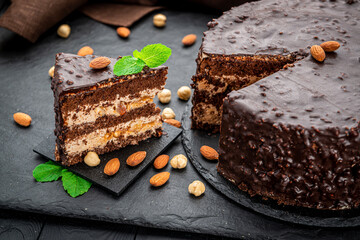 Delicious caramel chocolate tart, topped with nuts and hazelnuts, almonds