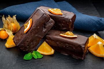 Delicious chocolate cakes on table close-up