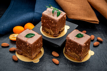 Delicious chocolate brownie with nuts on the table.