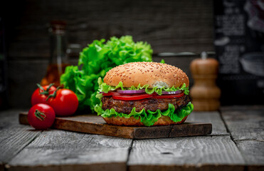 Fresh tasty burger on wood table