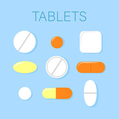 Set of orange and white pills in different shapes