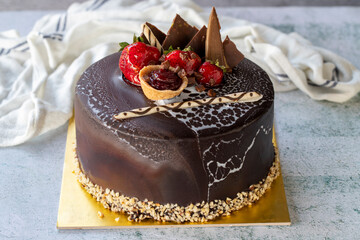 Chocolate celebration cake. Birthday cake on gray background. close up