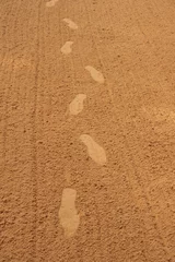 Fototapeten footprints in coarse sand © Bas