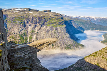 Trolltunga or Troll's Tongue early morning in Norway - 527825046