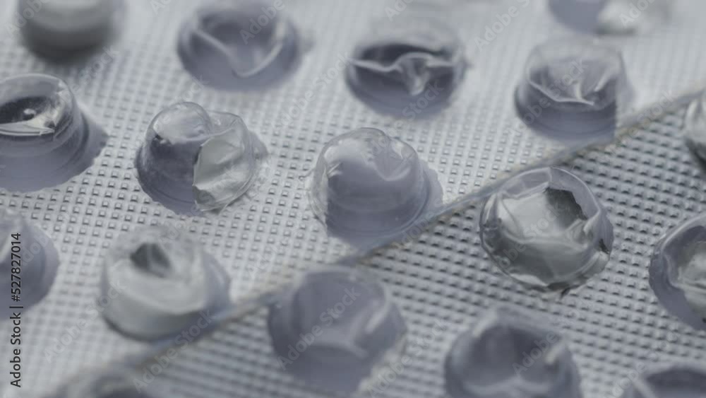 Poster an empty silver blister of pills rotates in a circle