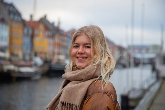 A teenage girl smiles while in Copenhagen, the Danish capital, on a cold winter day.