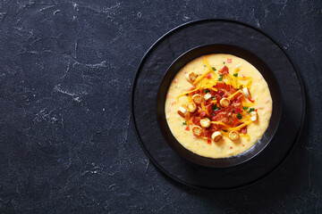 savory creamy pumpkin soup in bowl, top view
