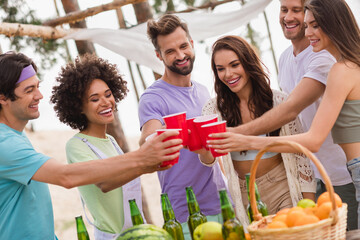 Portrait of group cheerful peaceful people hold plastic beer cups enjoy occasion celebration...