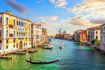 Gondoliers in the Grand Canal of Venice near Santa Maria della Salute, Italy