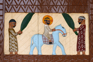 Artwork on the door of the Holy sacrament church, Dasso. Jesus entering Jerusalem on Palm Sunday
