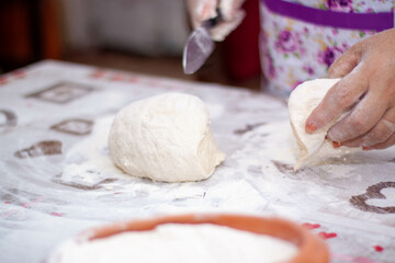 cutting the hand-kneaded dough with a knife