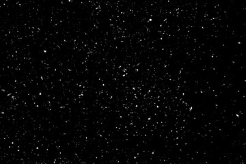 Naklejka na ściany i meble Chaotic white star bokeh on a isolated black background. falling blurry bokeh snow overlay, starry sky. white spots on black background, white drops and spots. abstraction