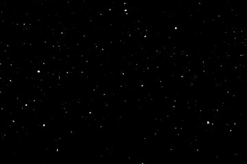 Chaotic white star bokeh on a isolated black background. falling blurry bokeh snow overlay, starry sky. white spots on black background, white drops and spots. abstraction