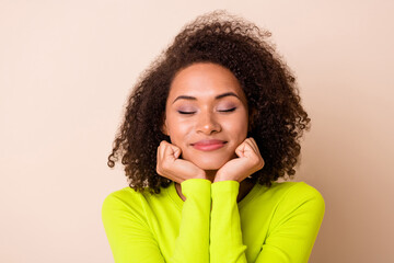 Closeup photo of young dreaming girl wear yellow jumper closed eyes want new car isolated on beige...