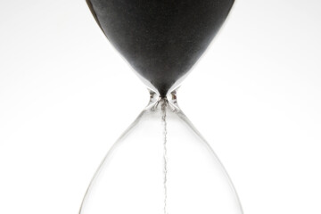 Hourglass on a light background. Time is money. Business solutions in time.