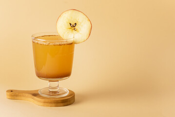 Hard Apple Cider Cocktail with Ground Cinnamon Tasty Autumn Beverage Copy Space Yellow Background Copy Space