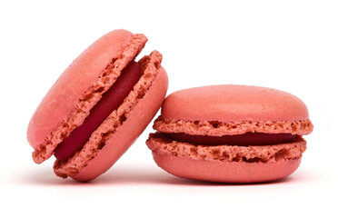 Two delicious strawberry macarons isolated on white background. Clipping Path. Full depth of field. Close-up