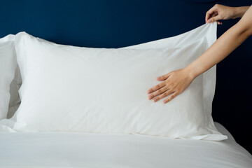 Making a bed in a hotel room