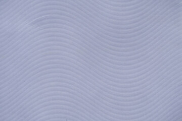 White- bluish wave textured paper background. Abstract light paper background texture with wave effect