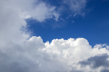 Naklejka na ściany i meble Events in the thick clouds or heavenly pictures. Blue sky with white fluffy clouds