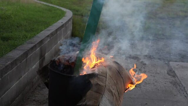 Dumpster Fire Large Orange Flames Lick Out of Trashcan Fire