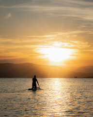 Sunset with paddle surfing