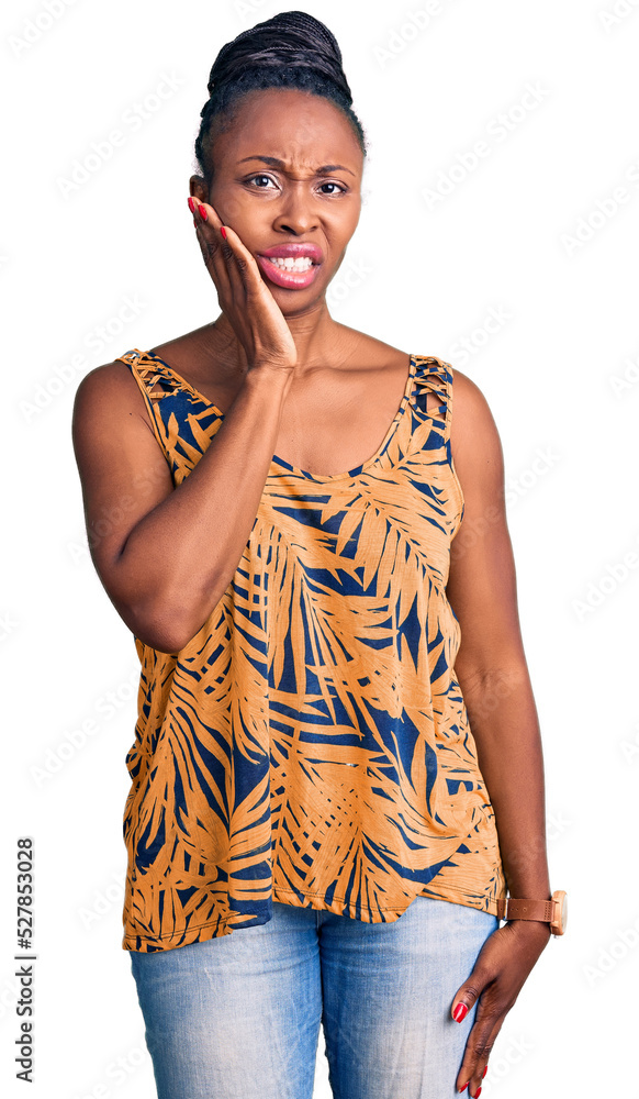 Wall mural Young african american woman wearing casual clothes touching mouth with hand with painful expression because of toothache or dental illness on teeth. dentist