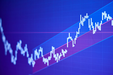 Rising stock market chart on blue background