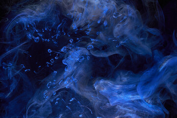 Liquid fluid art abstract background. Blue acrylic paint underwater, galactic smoke ocean