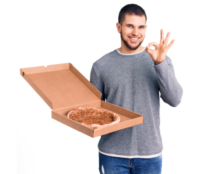 Young handsome man holding delivery italian pizza doing ok sign with fingers, smiling friendly gesturing excellent symbol