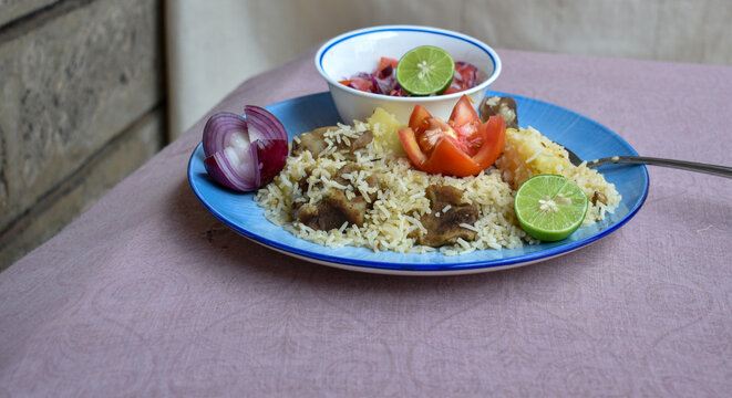 A plate of Kenyan pilau. Close up Shot from dinner's perspective. 