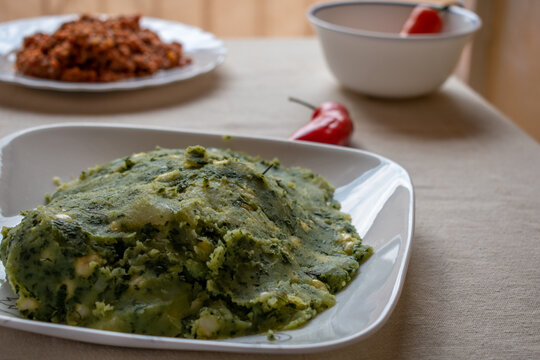 MUKIMO &mdash; Kenyan traditional dish of mashed potatoes and leafy greens.