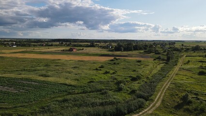 Aerial top view photo from flying drone of a land with down fields in countryside.