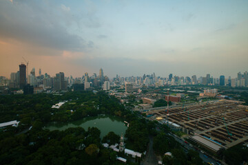 Fototapeta premium AErial view city green tree park around by modern office building