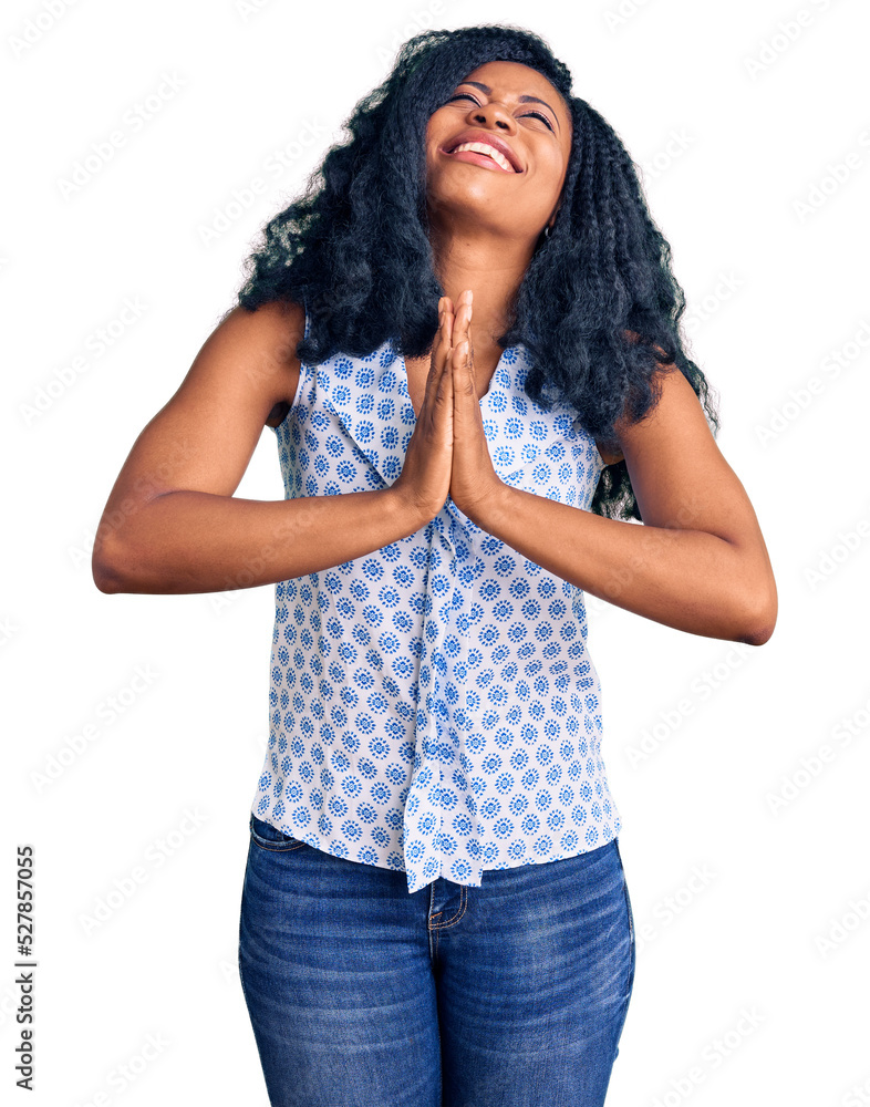 Wall mural Beautiful african american woman wearing casual summer shirt begging and praying with hands together with hope expression on face very emotional and worried. begging. - Wall murals