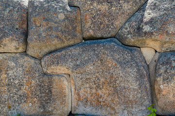 Close up view of wonderful stone wall made with large pieces of stone  in Alacahoyuk archaeological site, Corum, Turkey