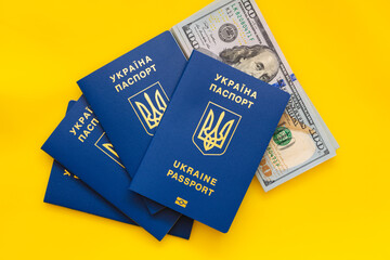 ukrainian passports and 100 dollar banknotes