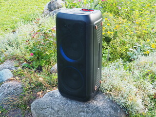 Party speaker with bluetooth and karaoke. Garden party equipment. Black music speaker 