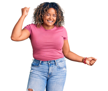 Young african american plus size woman wearing casual clothes dancing happy and cheerful, smiling moving casual and confident listening to music