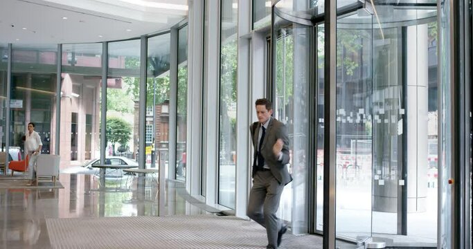 Happy, celebration and funny businessman dancing in the lobby at work winning and excited about promotion or success in professional career. Crazy company employee dance in the morning to celebrate