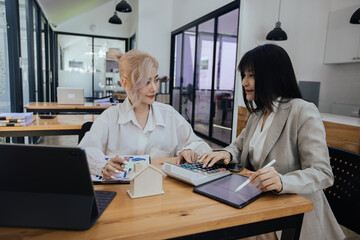 Technology and financial advisory services concert. Business teamwork and working on digital laptop computer with advisor showing plan of investment to clients at table office. Digital marketing.