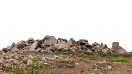 Isolated debris of many concrete blocks that were left on the ground and grass, which came from the demolition of rural roads.
