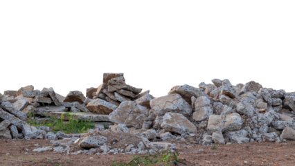 Many of the concrete debris is damaged by the removal of old roads that have been left on the ground and grass growing.