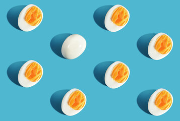Difference pattern slice boiled eggs on blue background. Think different concept and business...